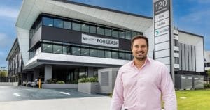 Adrian Puljich outside GemLife’s new national headquarters in Helensvale, Gold Coast. Photo: GemLife 