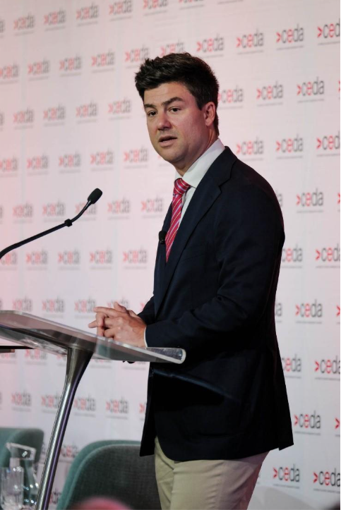 A person standing at a podium

AI-generated content may be incorrect.