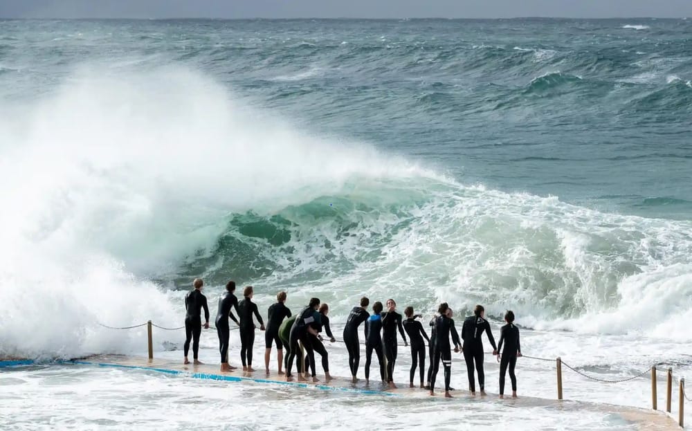 Social distancing? Young Australians ignore 1.5 metre rule as big waves beckon post image